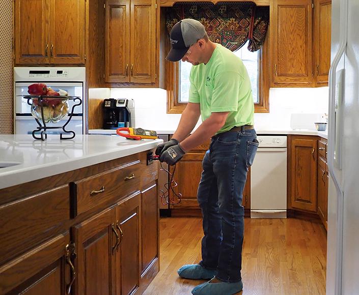 McElroy Electric electrician troubleshoots an under-cabinet kitchen outlet.