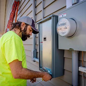 A McElroy Electric electrician, connects a new Kohler backup generator to the residence’s electrical system.