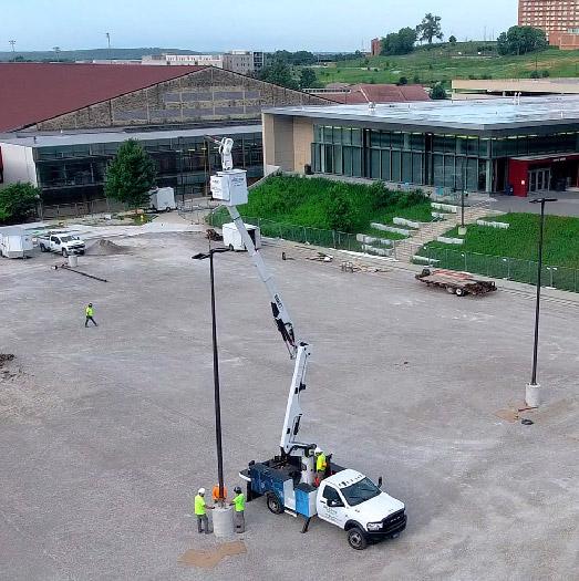 McElroy Electric Ram 5500 Versalift bucket truck setting lights near Allen Fieldhouse at the University of Kansas.